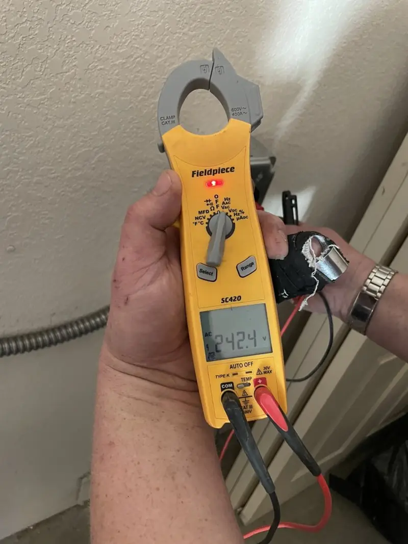 Voltage testing with clamp meter during Outlet Installation in Pompey
